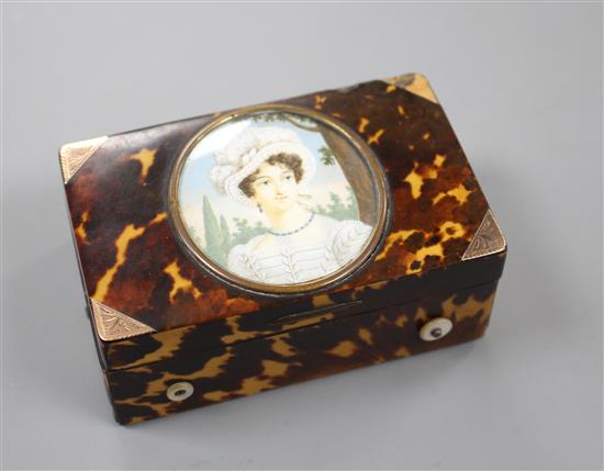 A late 19th century Swiss gold mounted tortoiseshell musical box, inset with a miniature of a young lady, width 8cm depth 5.5cm height